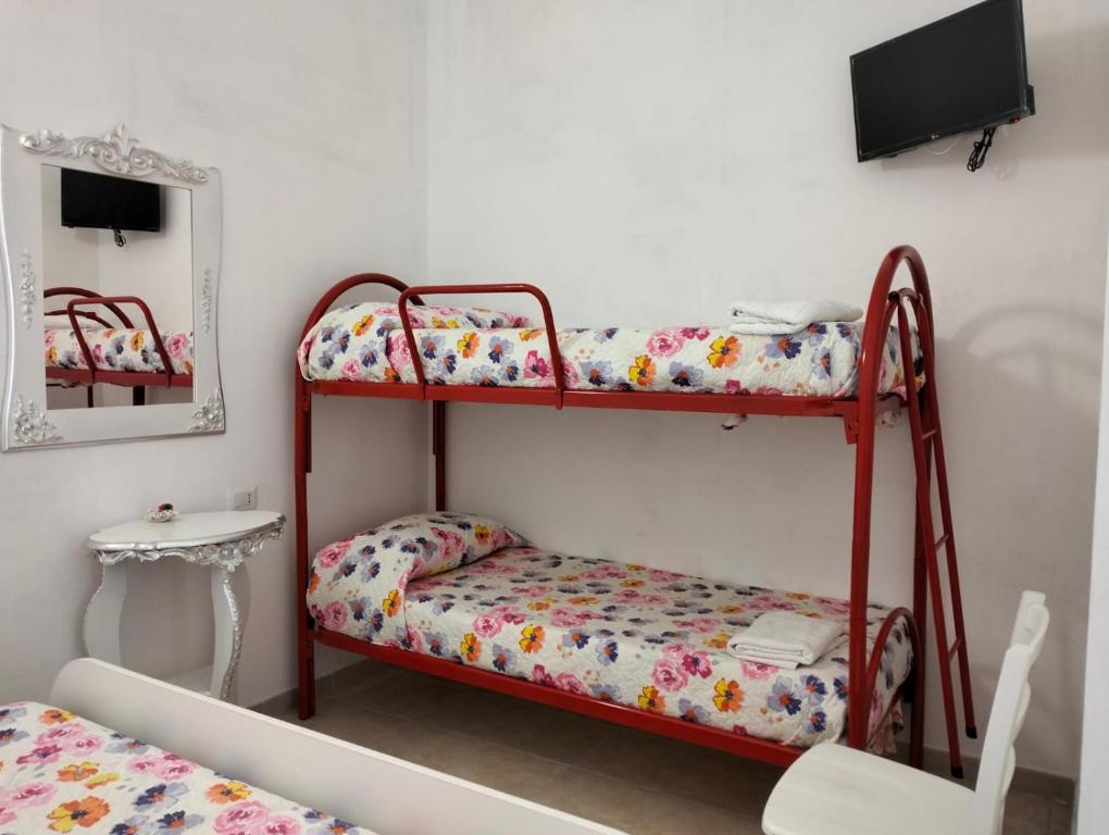 Postel nebo postele na pokoji v ubytování Orazio U Vitturisi
