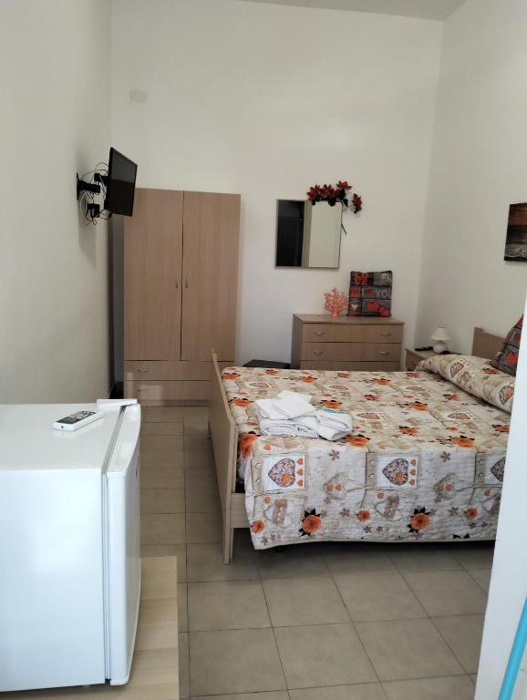 Postel nebo postele na pokoji v ubytování Orazio U Vitturisi