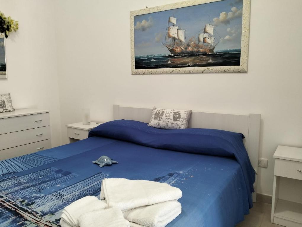 Postel nebo postele na pokoji v ubytování Orazio U Vitturisi