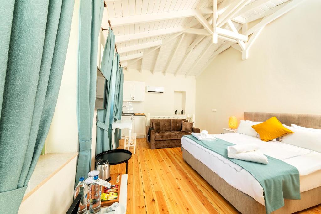 Postel nebo postele na pokoji v ubytování Mets Boutique Hotel