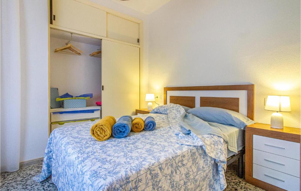 A bed or beds in a room at 3 Bedroom Nice Apartment In San Javier