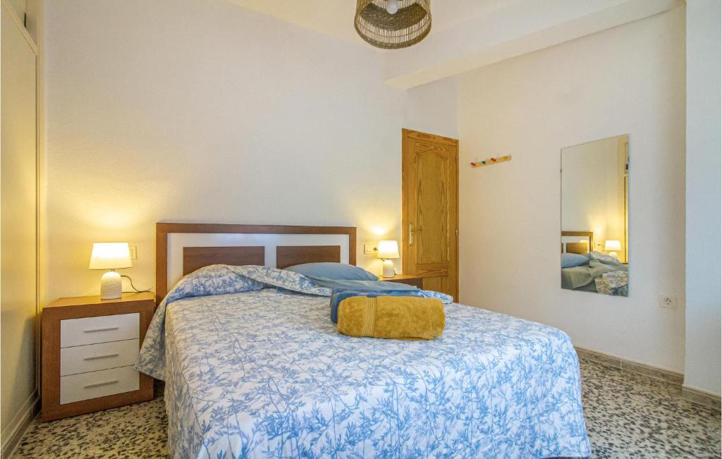 A bed or beds in a room at 3 Bedroom Nice Apartment In San Javier