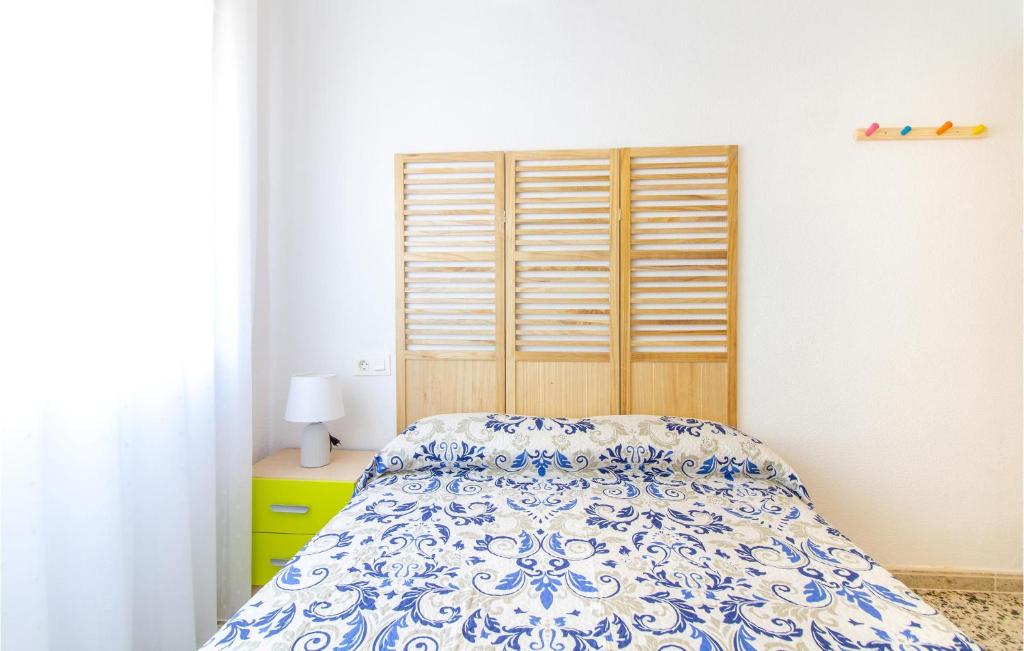 A bed or beds in a room at 3 Bedroom Nice Apartment In San Javier
