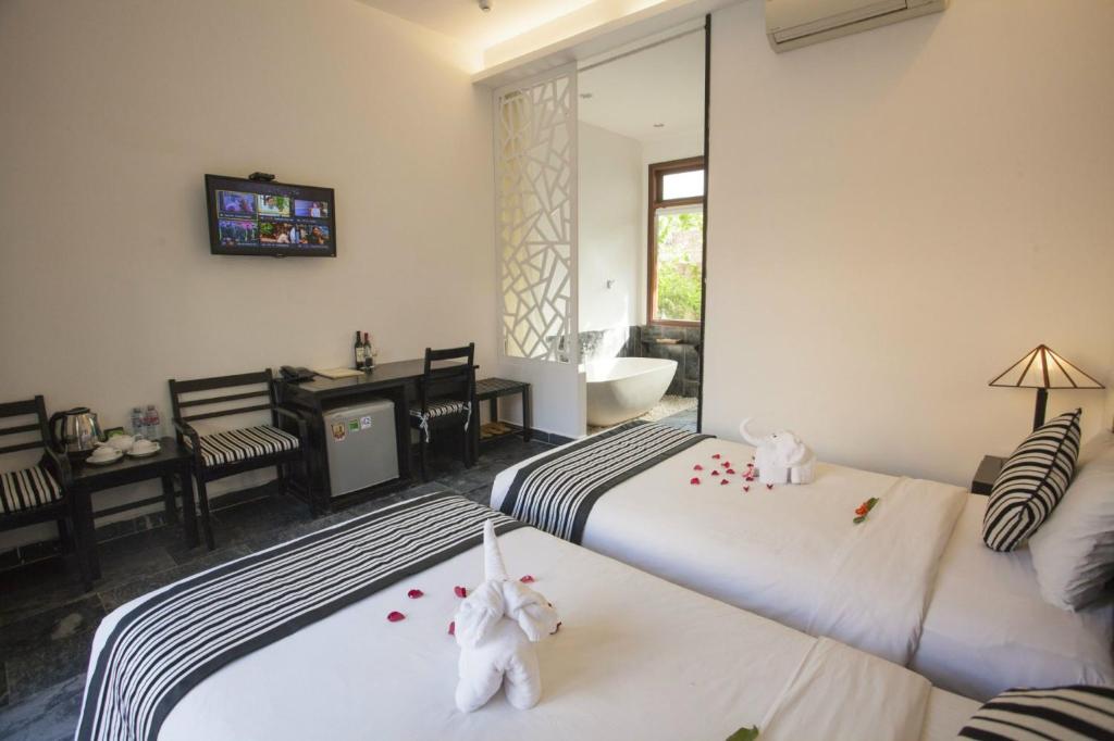 Cama o camas de una habitación en Hoi An TNT Villa