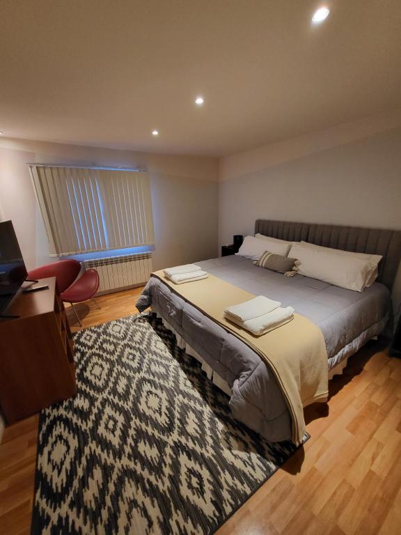 Un pat sau paturi într-o cameră la Casa Magallanes