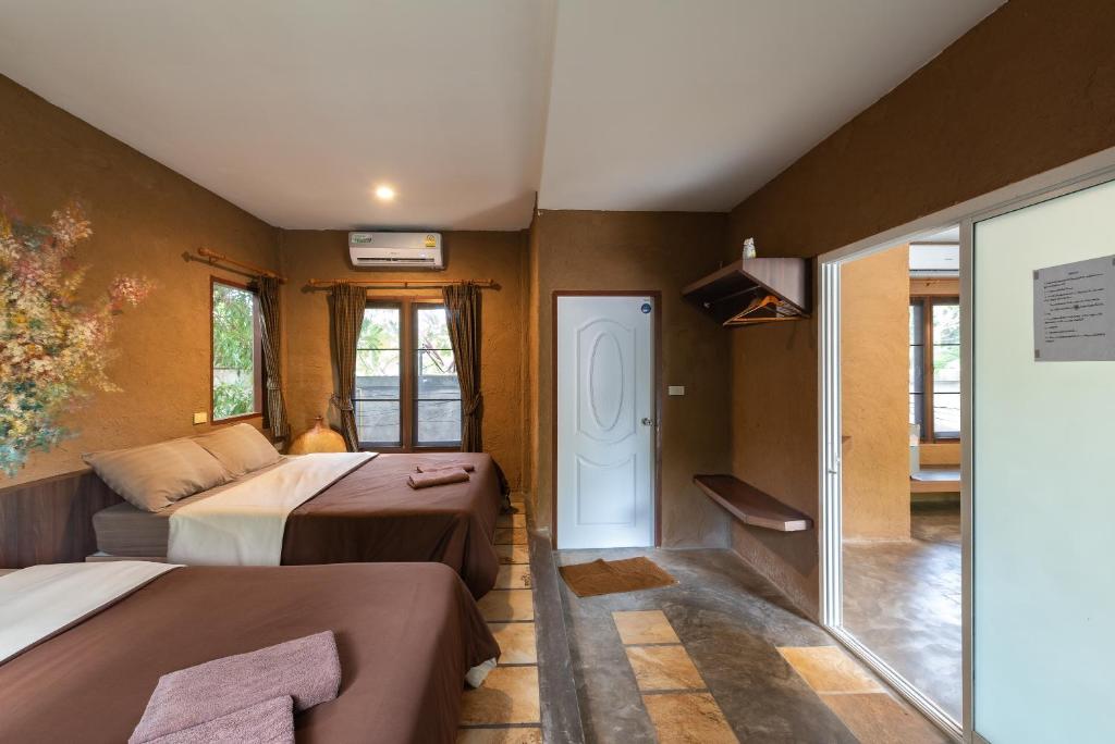 Postel nebo postele na pokoji v ubytování Muntra Garden Resort