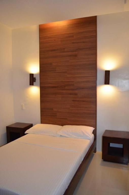 Letto o letti in una camera di Taj Guesthouse Boracay