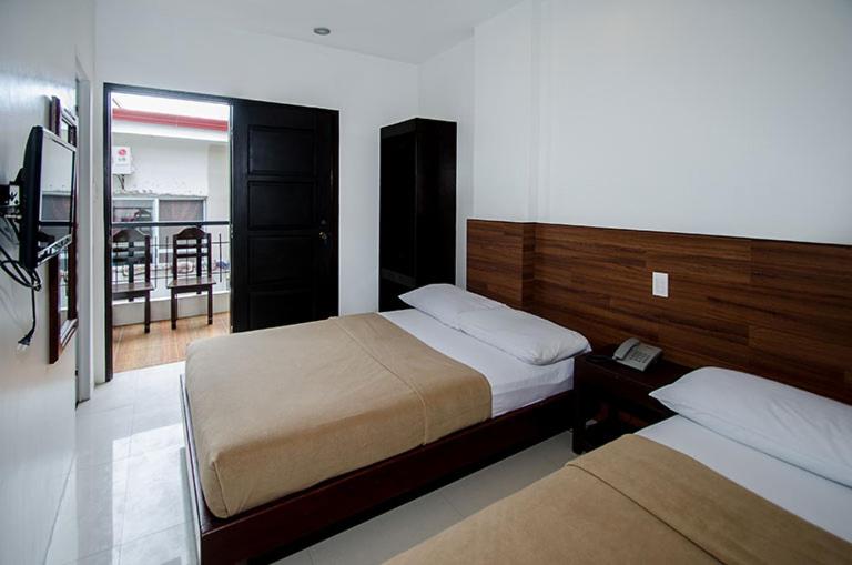 Krevet ili kreveti u jedinici u objektu Taj Guesthouse Boracay