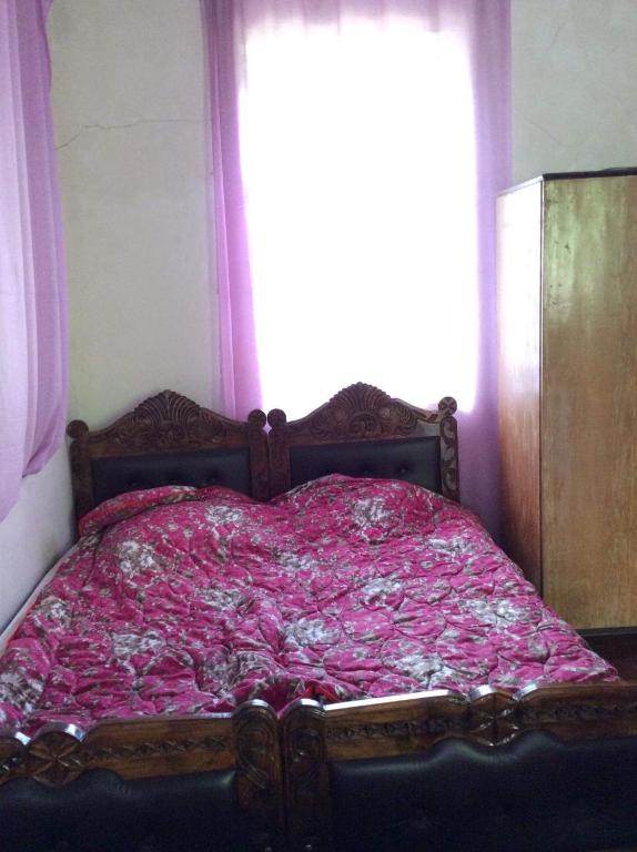 Llit o llits en una habitació de Gunter Guest house
