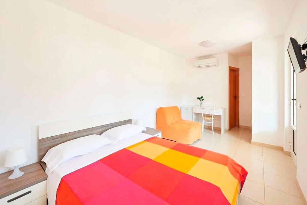 Postel nebo postele na pokoji v ubytování Camping Cala dei Ginepri