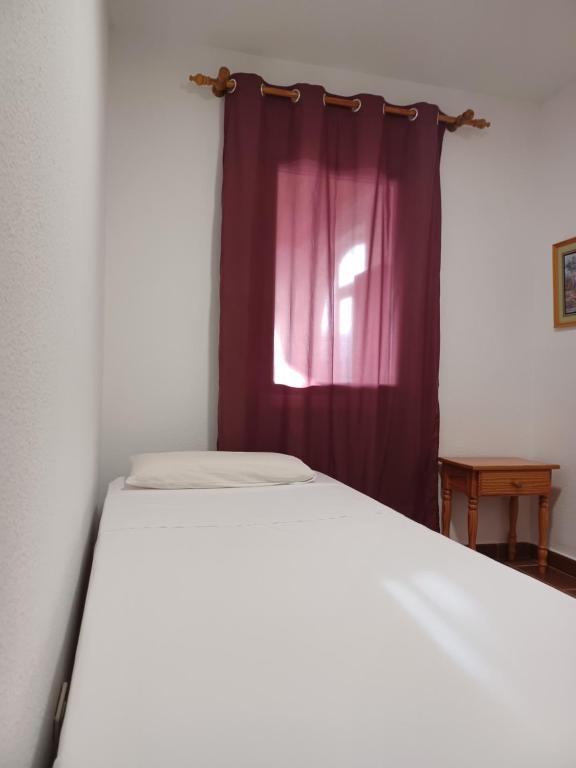 Postel nebo postele na pokoji v ubytování APARTAMENTO MAYI 2
