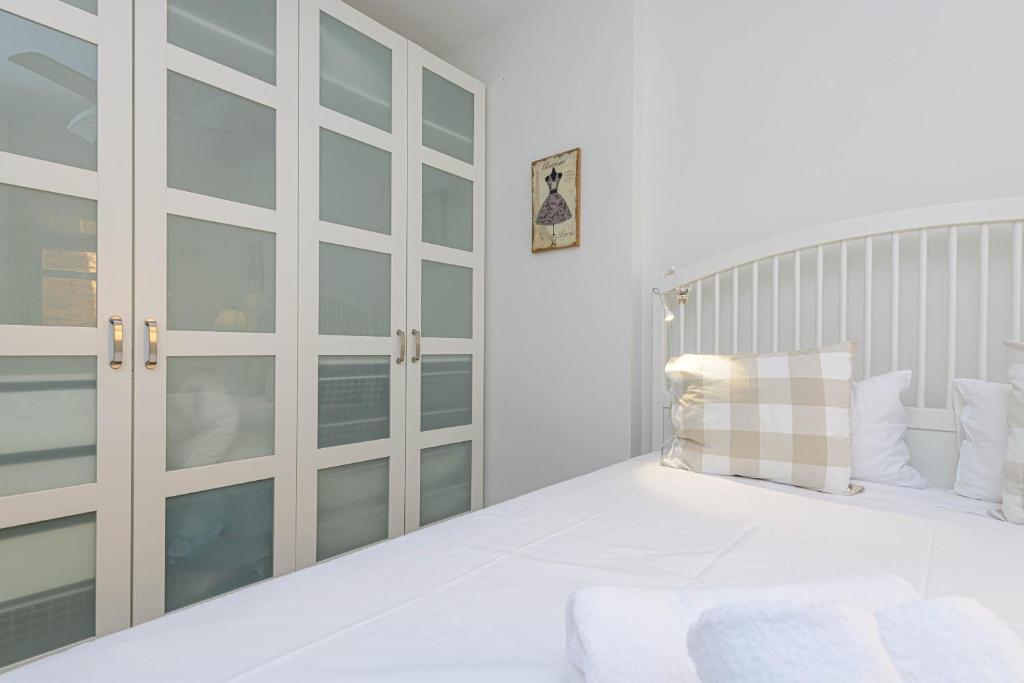 Łóżko lub łóżka w pokoju w obiekcie WintoWinRentals Genial Apartamento, Céntrico y Silencioso