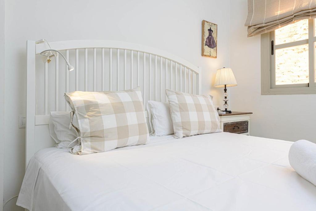 Łóżko lub łóżka w pokoju w obiekcie WintoWinRentals Genial Apartamento, Céntrico y Silencioso