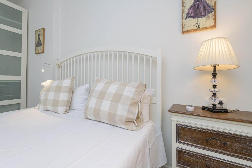 Łóżko lub łóżka w pokoju w obiekcie WintoWinRentals Genial Apartamento, Céntrico y Silencioso