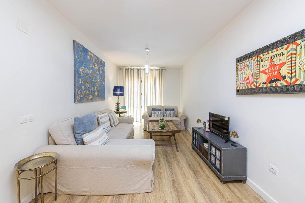 Telewizja i/lub zestaw kina domowego w obiekcie WintoWinRentals Genial Apartamento, Céntrico y Silencioso
