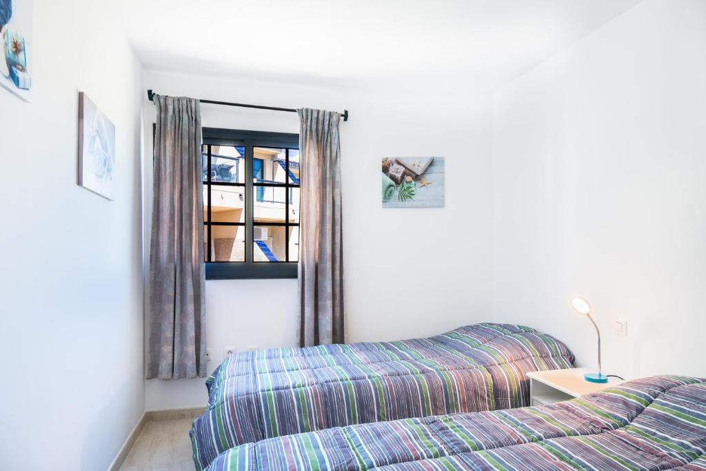 A bed or beds in a room at Casa Marine