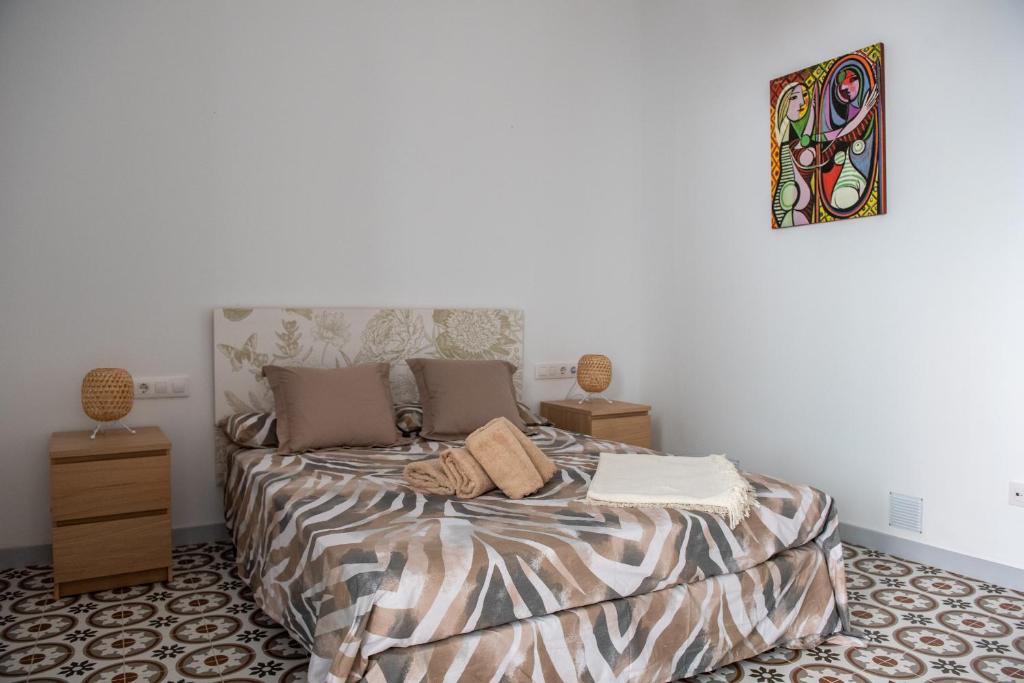 Postel nebo postele na pokoji v ubytování Hauzify I Apartament Can Missé