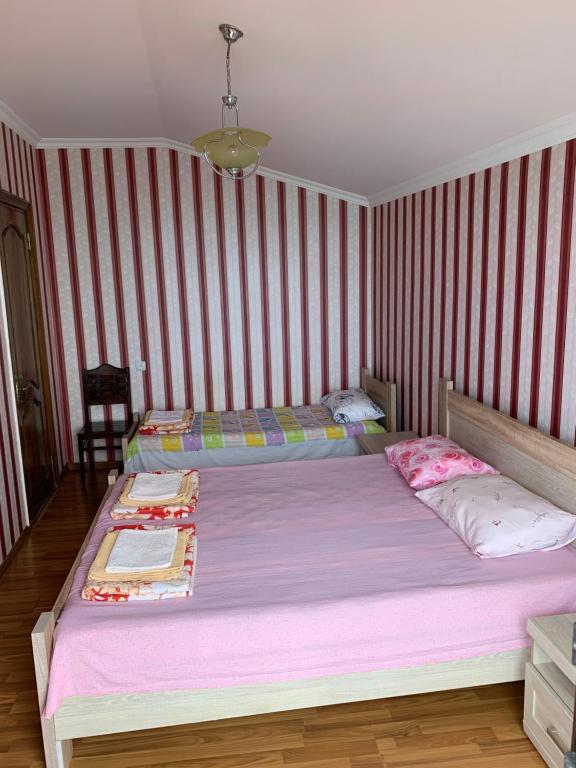 Postel nebo postele na pokoji v ubytování Guest House Rusalka