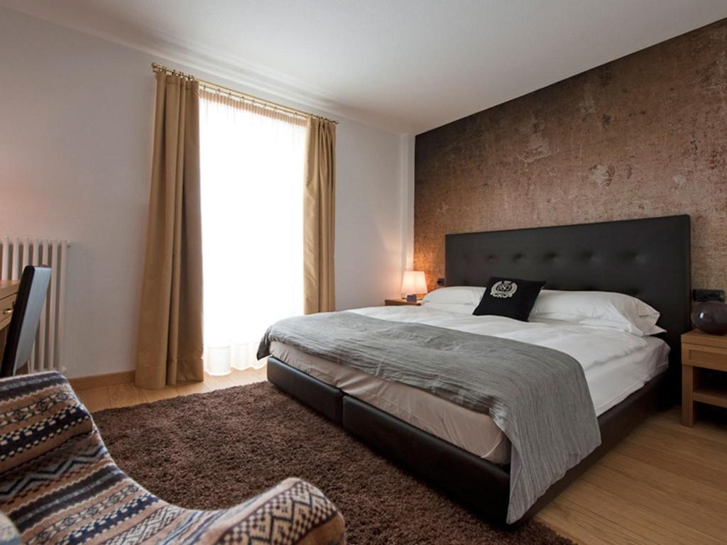 Postel nebo postele na pokoji v ubytování Hotel Principe delle Nevi