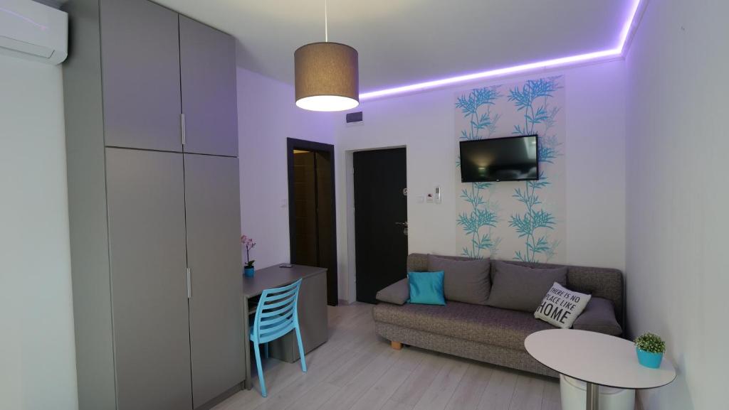 Televízia a/alebo spoločenská miestnosť v ubytovaní Anna Villa Füred Boutique Rooms