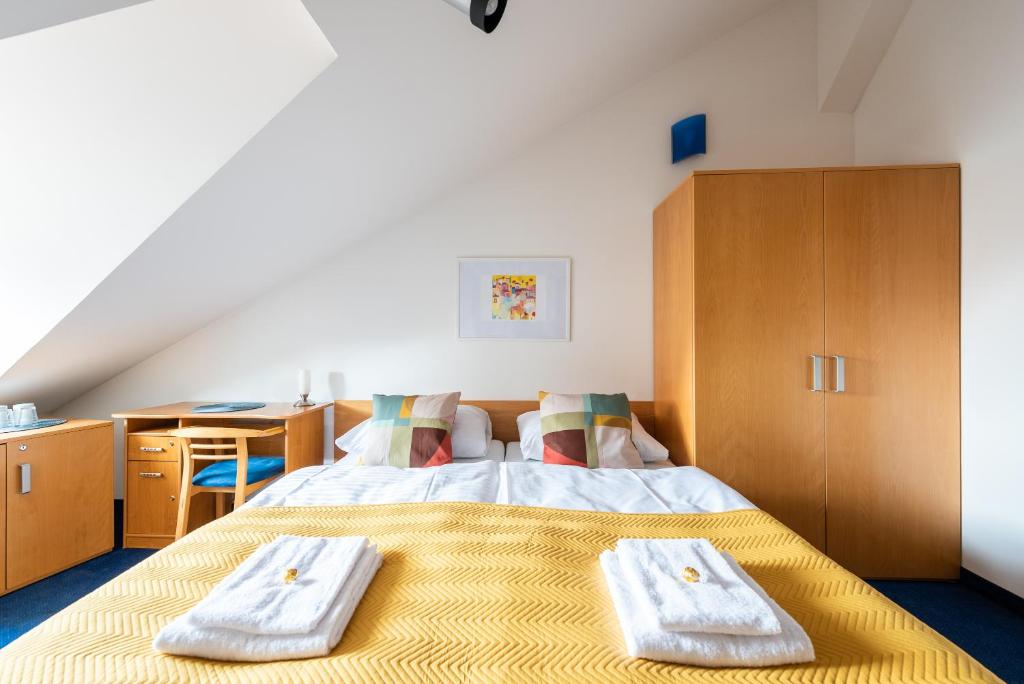 Postel nebo postele na pokoji v ubytování Libero Residence