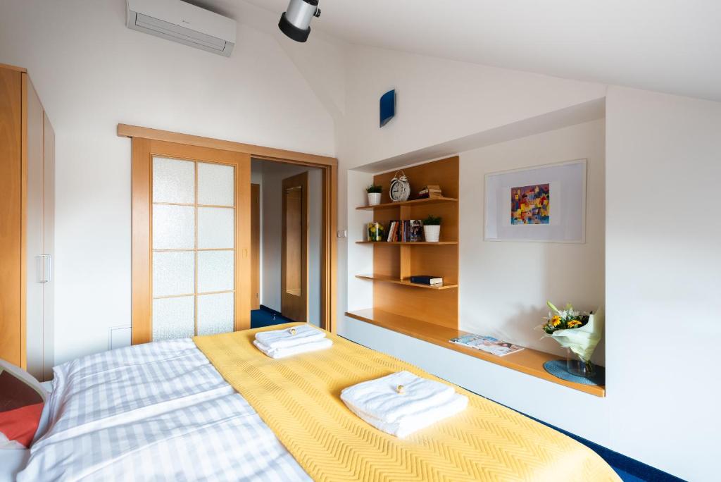 Postel nebo postele na pokoji v ubytování Libero Residence