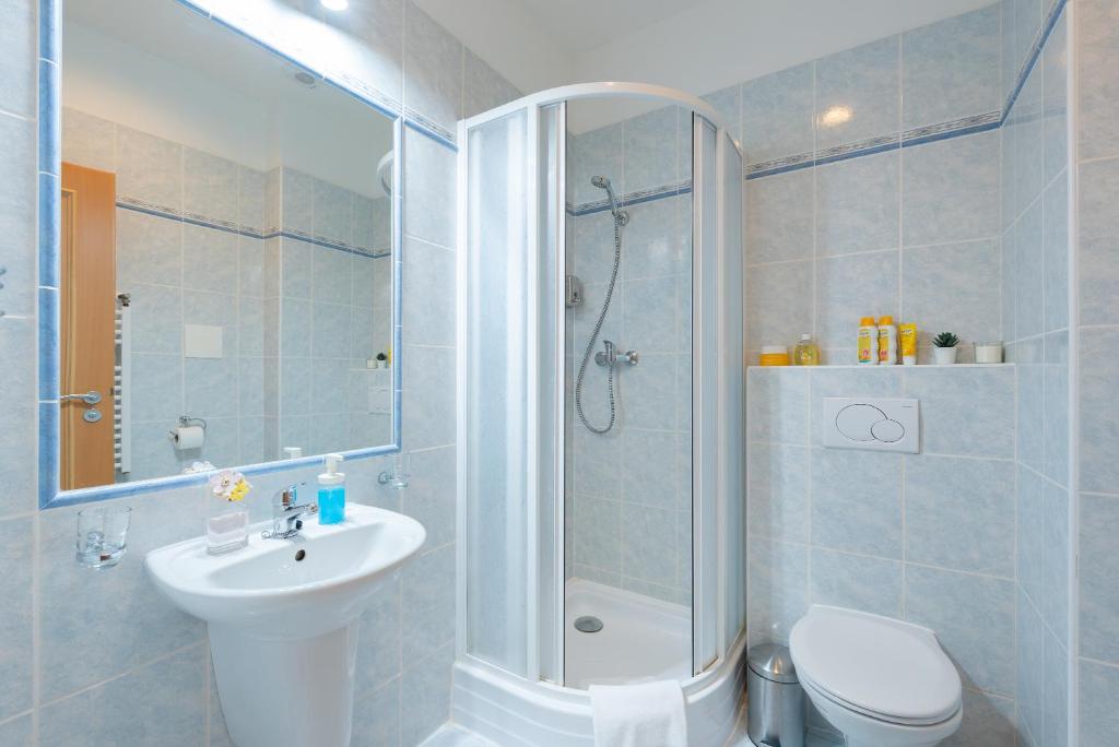 Koupelna v ubytování Libero Residence