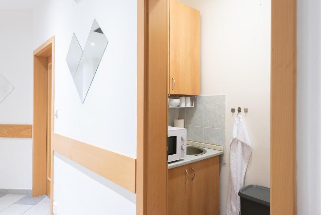 Kuchyň nebo kuchyňský kout v ubytování Libero Residence