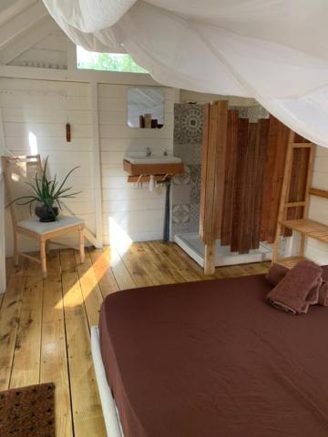 Postel nebo postele na pokoji v ubytování Akunamatata Guest House Cul de Sac