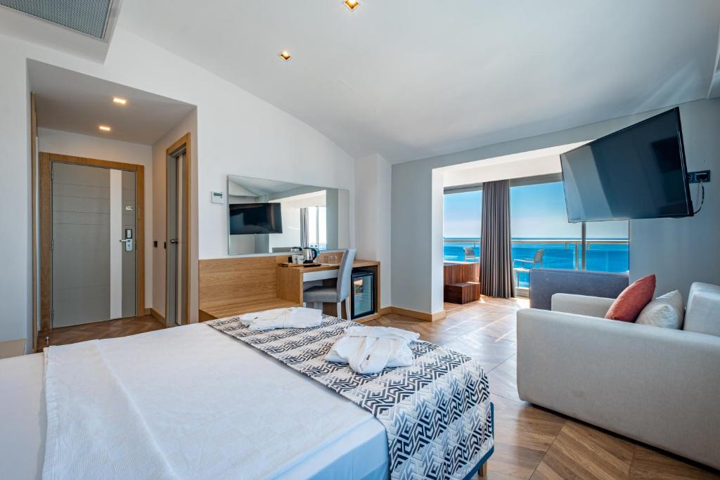 Postel nebo postele na pokoji v ubytování PEARLY HOTEL