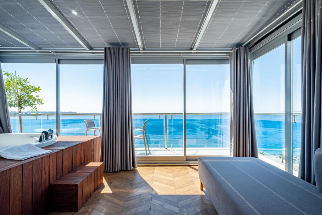 Postel nebo postele na pokoji v ubytování PEARLY HOTEL