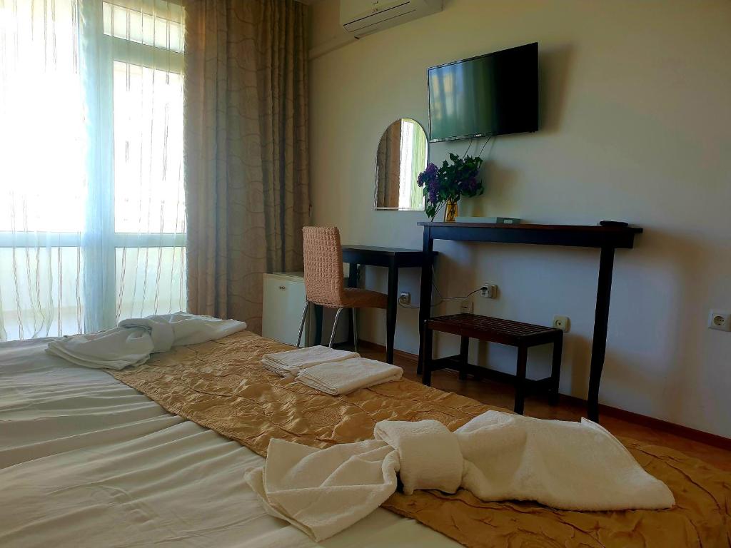 Postel nebo postele na pokoji v ubytování Hotel Feniks Lozenets