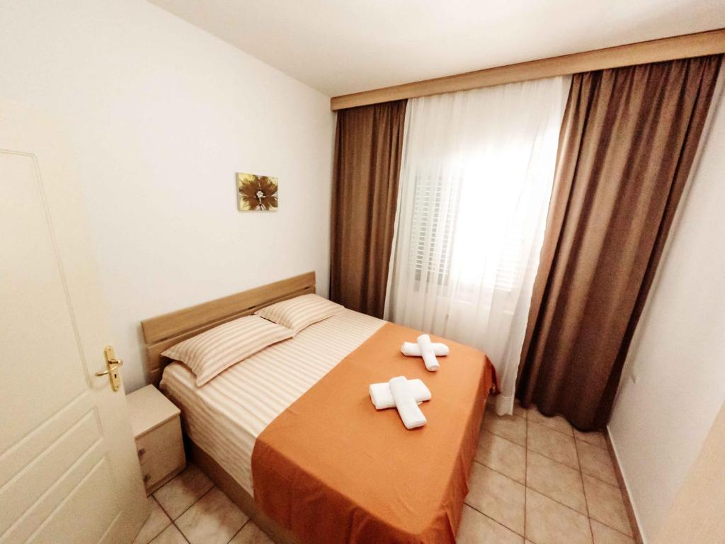 Postel nebo postele na pokoji v ubytování Apartments Vila Pavaci
