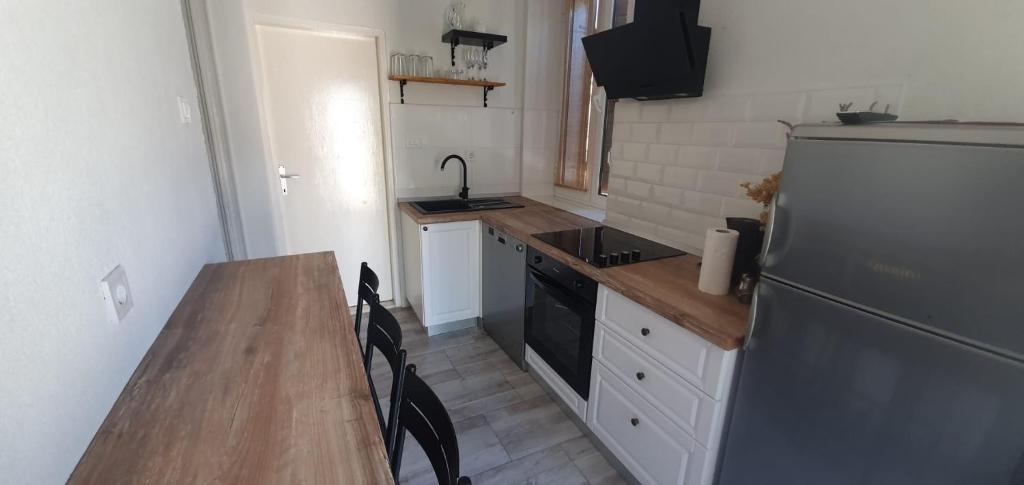 Kuchyň nebo kuchyňský kout v ubytování Apartments Kut