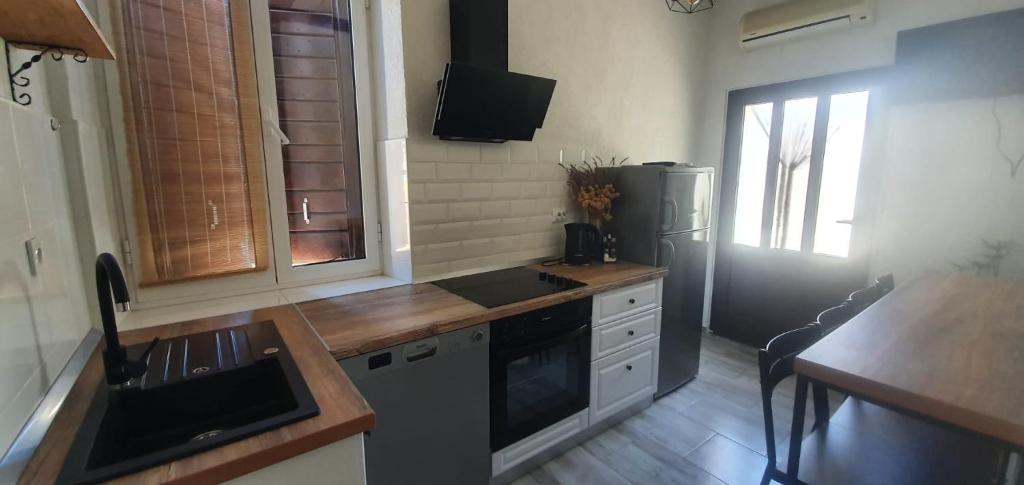 Kuchyň nebo kuchyňský kout v ubytování Apartments Kut