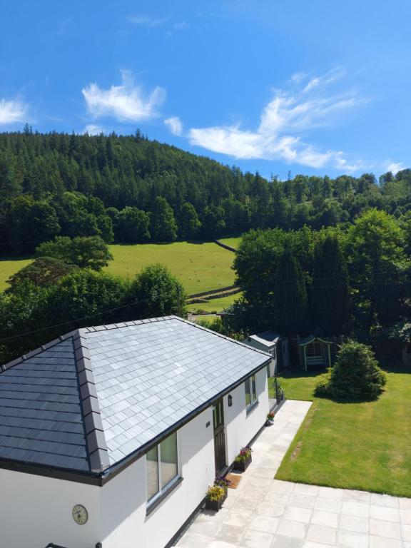 an aerial view of a house with a roof at Glenwood luxury Cottage Betws-y-coed in Betws-y-coed
