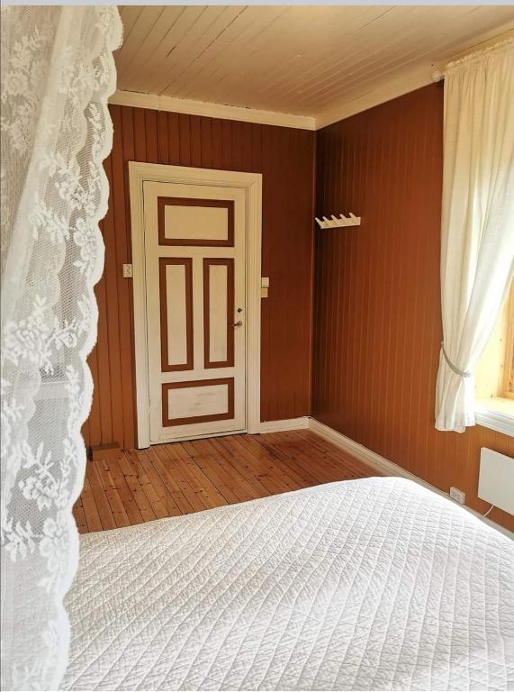 Postel nebo postele na pokoji v ubytování Tranøya