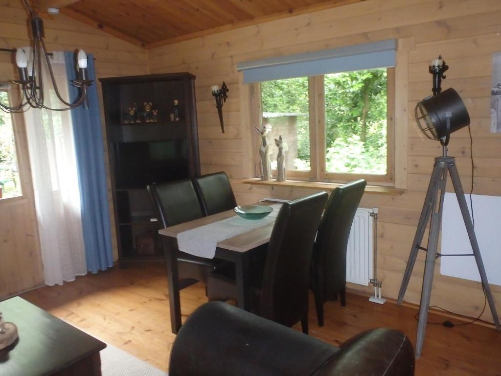 TV a/nebo společenská místnost v ubytování Huis H8