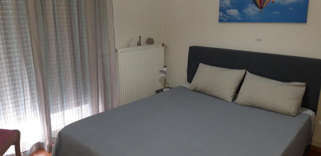 Posteľ alebo postele v izbe v ubytovaní PANOS HOUSE