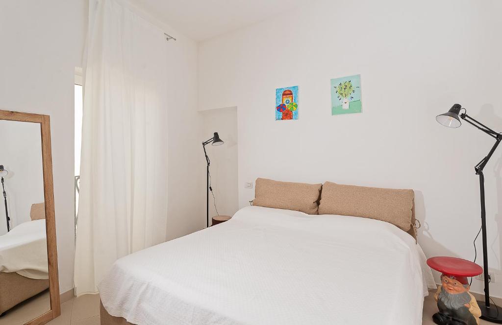 A bed or beds in a room at A casarella in piazzetta