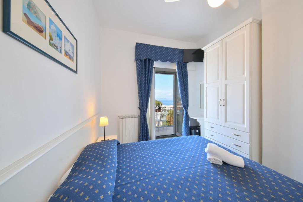 Postel nebo postele na pokoji v ubytování Hotel Noris