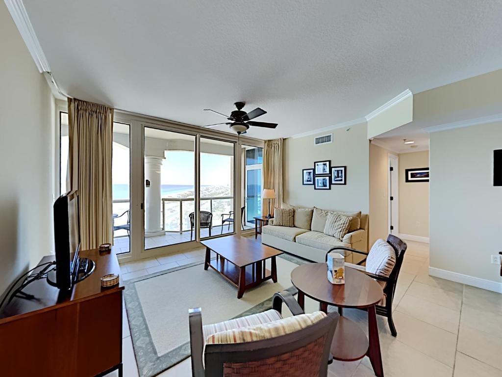 a living room with a couch and a table at Port51403 in Pensacola Beach