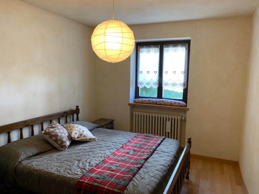 Postel nebo postele na pokoji v ubytování Bielmonte Appartamenti