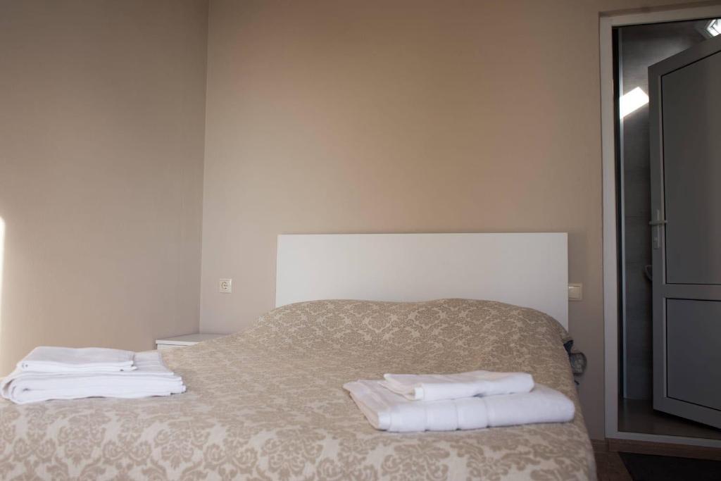 Postel nebo postele na pokoji v ubytování nira hotel