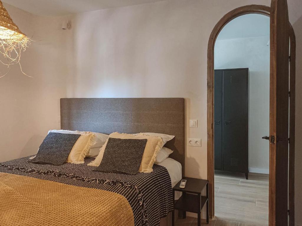 a bedroom with a bed and a large mirror at Malaga stylish beach apartments in Málaga