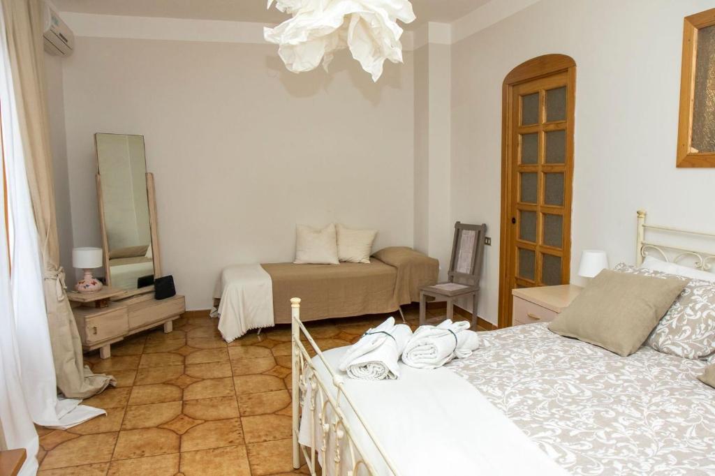 Postel nebo postele na pokoji v ubytování SEASCAPE - Noemi's Rooms