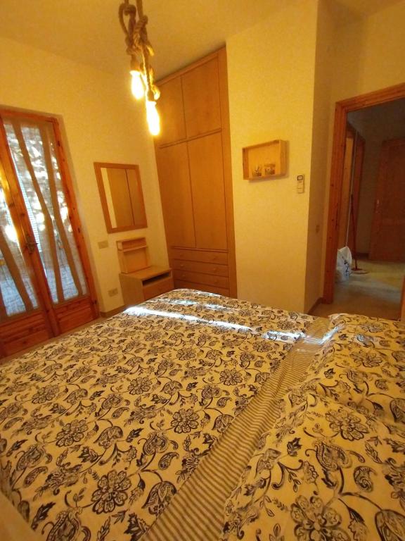 Łóżko lub łóżka w pokoju w obiekcie casa luisa3br
