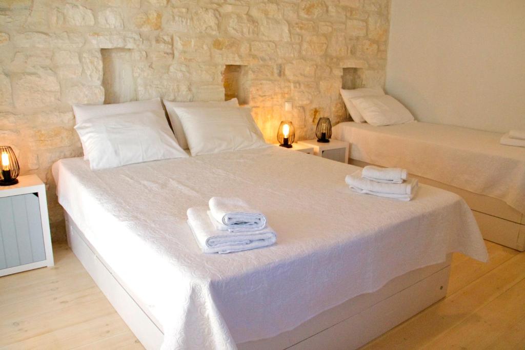 Postel nebo postele na pokoji v ubytování Nomads House