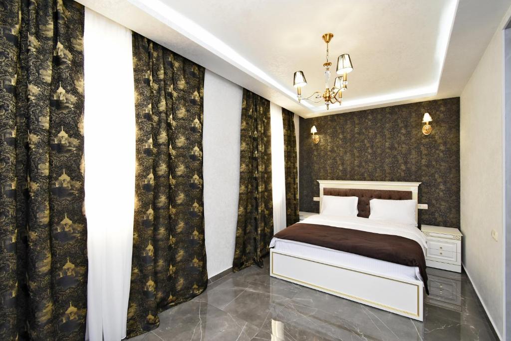 Postel nebo postele na pokoji v ubytování Macao Hotel