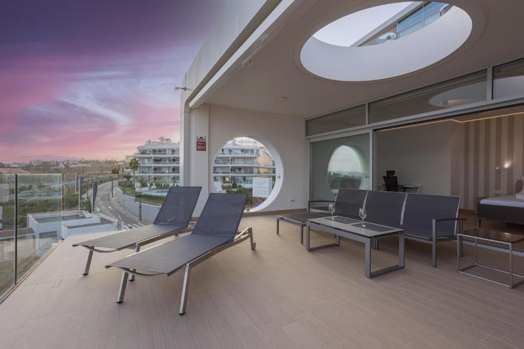 A balcony or terrace at Ensuite Penthouse Panoramic Sea View with Jacuzzi